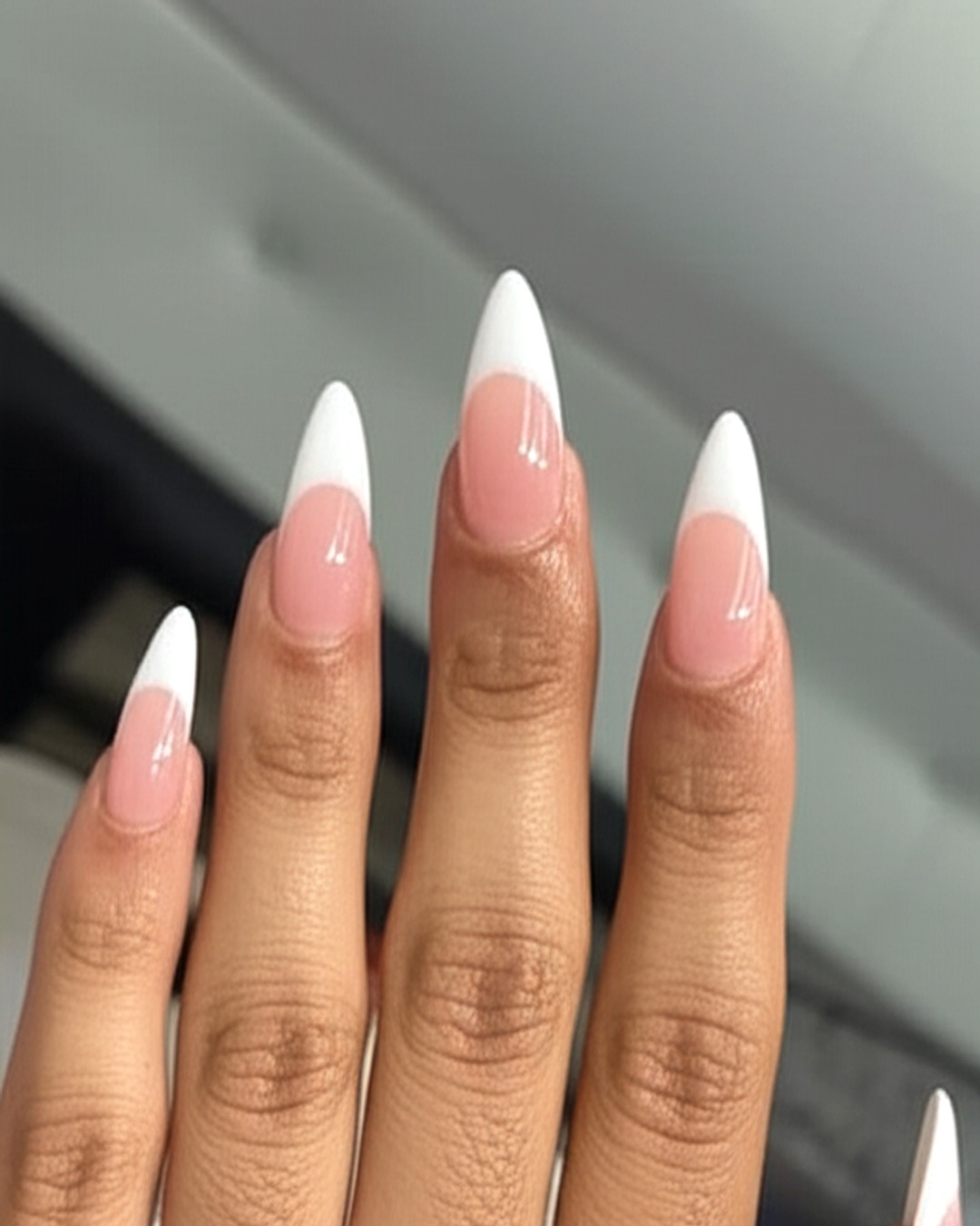 White French tips on long stiletto nails
